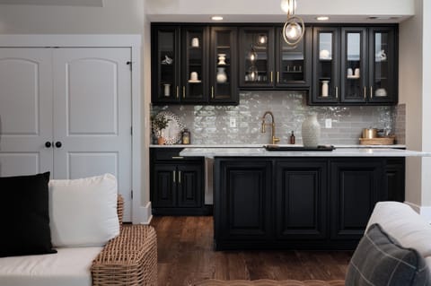 Lower level wet bar with mini-fridge perfect for game day snacks.