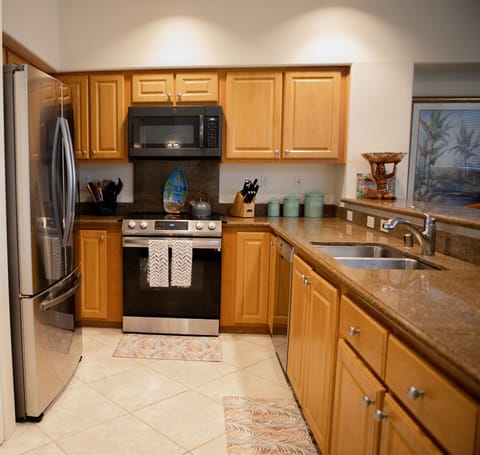 Gourmet kitchen, granite counter tops, stainless steel appliances, pantry.