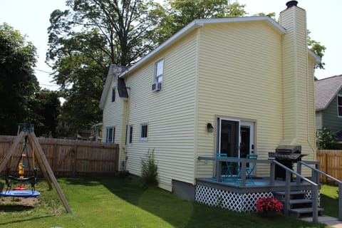 backyard with  grill and bistro on deck and playset!