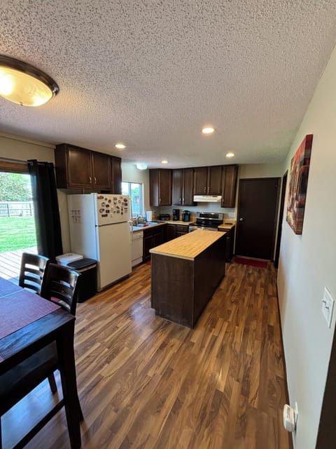 Kitchen with refrigerator, stove, dishwasher, microwave, Keurig and toaster.