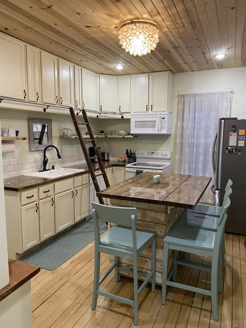 Kitchen.  Ladder can be removed.  Everyday needs are easily in reach on shelves.