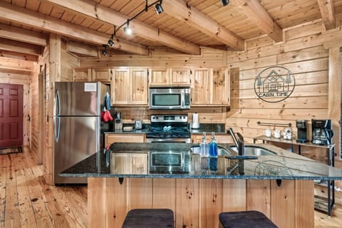 Fully stocked kitchen with granite counters .