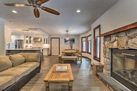 View from deck shows fireplace area, dining room and kitchen
