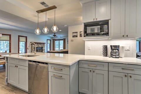 Kitchen has dishwasher, microwave, coffee maker