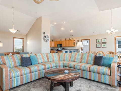 Relax in the beautiful Living Area with high ceilings and lots of natural light.