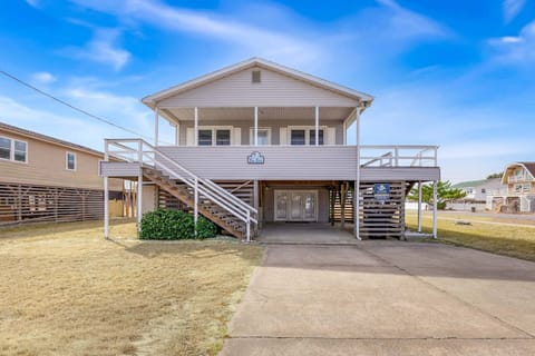Tranquil Seaside sits just 250 yards from the beach, offering easy access via a private walkway and charming coastal curb appeal.
