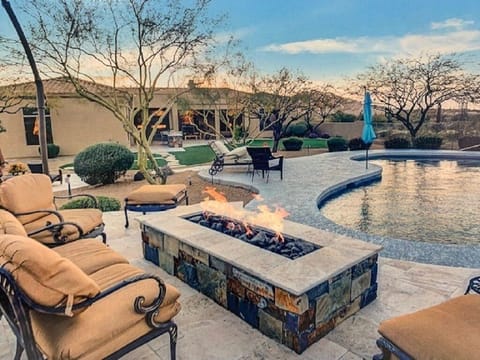 Poolside gas fireplace with views of Black Mountain