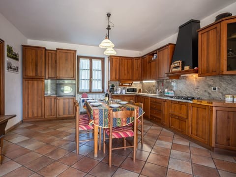 Furniture, Cabinetry, Table, Countertop, Wood, Lighting, Chair, Kitchen, Picture Frame, Interior Design