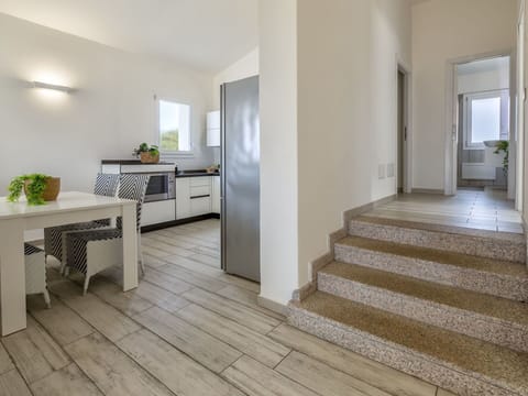 Building, Table, Wood, Interior Design, Hall, Houseplant, Floor, Cabinetry, Flooring