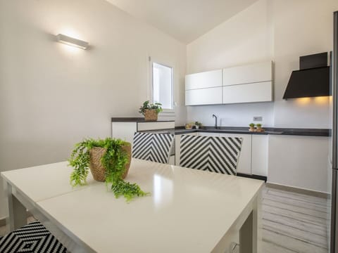 Cabinetry, Furniture, Plant, Table, Countertop, Interior Design, Building, Window, Rectangle, Floor