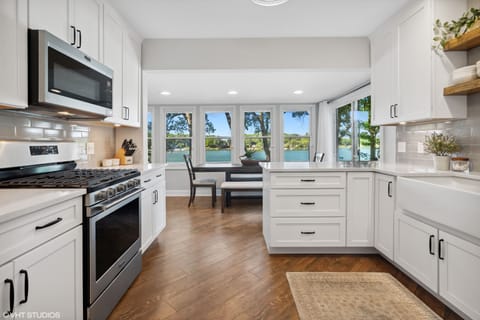 Updated Kitchen With Quartz Counters, Newer Appliances, & White Cabinets