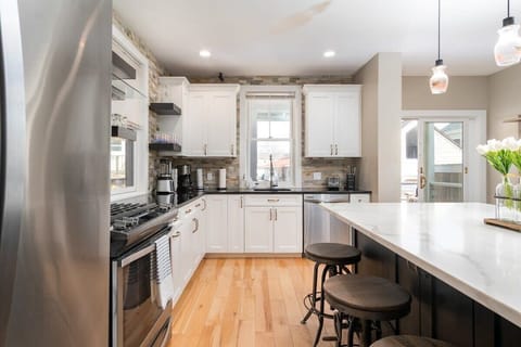 A dream chef's kitchen, with top appliances, perfect for dining and entertaining