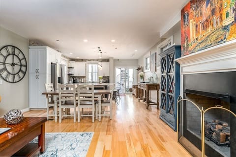 Beautiful & expansive open concept living room/kitchen with patio access.  NOTE: the fireplace is inoperable and may not be used.