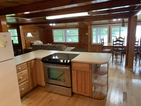 from kitchen, looking out to the dining room, sitting area and the lake