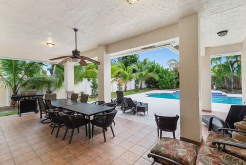 Lanai with Grill & Dining Area By The Pool