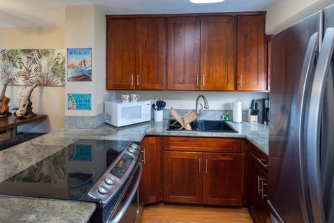 Kitchen area with everything you need, coffee maker, rice cooker, pots & pans.
