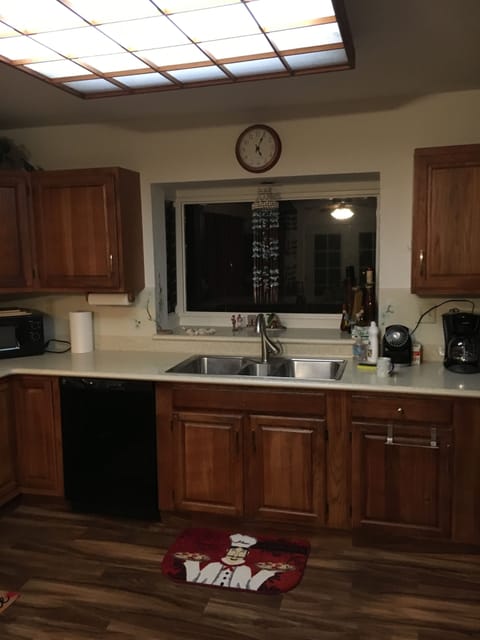Kitchen, range and oven to the left, refrigerator to the right