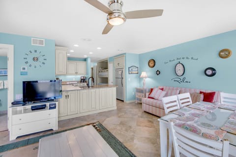 Dining table next to living room couch