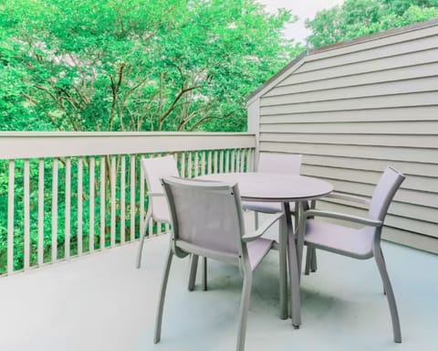 Sip morning coffee on the private balcony among the trees.