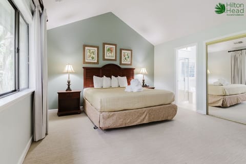 Sink into plush pillows in this airy primary retreat.
