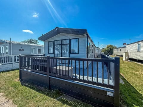 Relax outside your caravan with decking at Pakefield Holiday Park, a top choice for British staycations and last minute caravan holidays near Suffolk beaches UK.