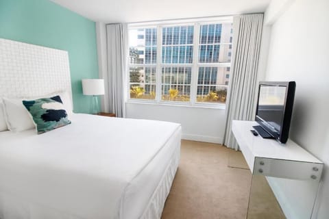 Wake up to daylight pouring through oversized city-view windows.