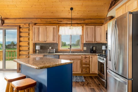Full kitchen with drip coffee maker.