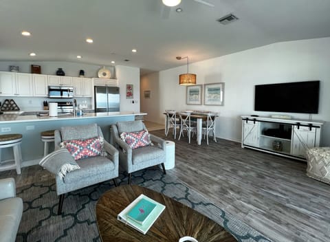 Large smart TV in the living room to catch up on your favorite s - Large smart TV in the living room to catch up on your favorite shows and movies after a long day relaxing at the beach and pool.