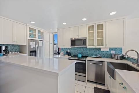 Ocean blue back splash that complements the view of the ocean