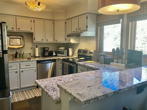 Well equipped kitchen offering extra seating at the breakfast bar