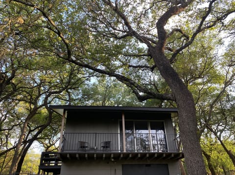 Relax on your treehouse-like back balcony.