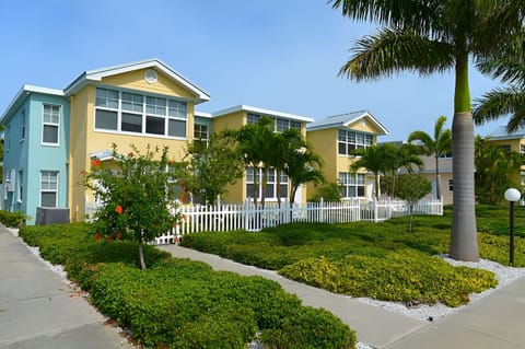 Soak up sunshine among colorful buildings and manicured tropical gardens.