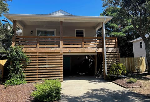 Top level: 885 sq ft of living space & spacious deck. Bottom: storage & laundry