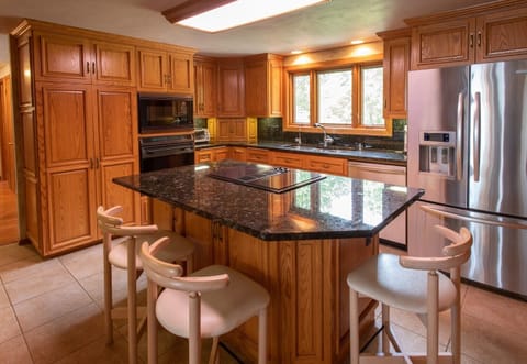Fully equipped kitchen with upscale appliances.