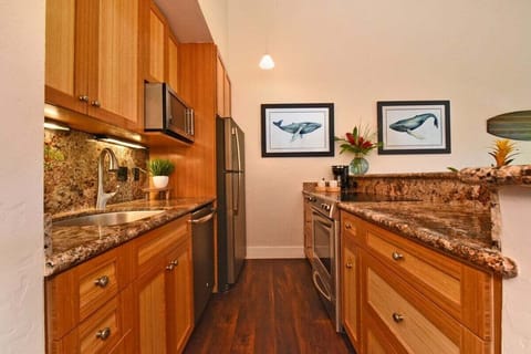 Cook in style with stainless steel appliances, granite countertops, and tropical touches that bring the outdoors in.