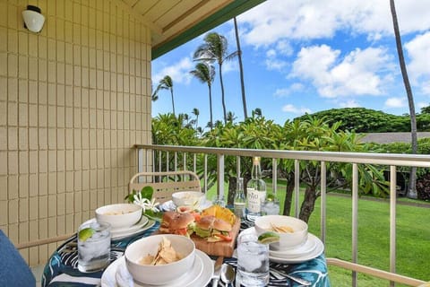 Enjoy fresh meals on the balcony surrounded by palm trees, blue skies, and tropical greenery — a perfect start to any day.