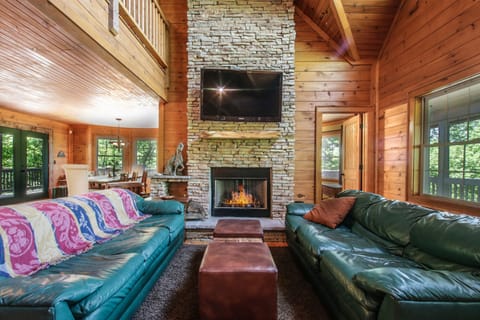 Living room with gas fireplace and large screen television.  Plenty of space.
