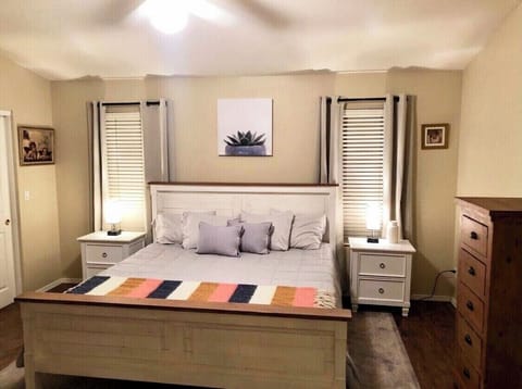 Spacious Master bedroom with king mattress, large walk in closet and 50” TV. 