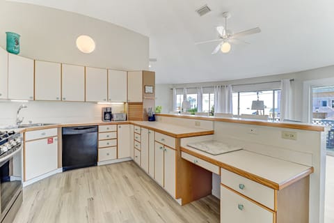 Second Floor Fully Equipped Kitchen with Stainless Steel Appliances and Bar Stool Seating for 5