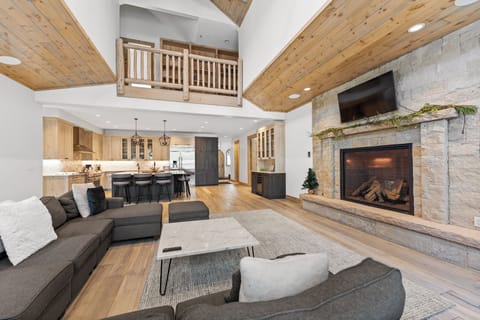 Open-concept space with a vaulted ceiling and ample lighting.