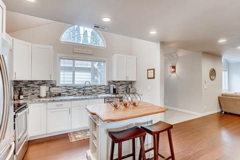 Another view of the kitchen area and the entry hallway