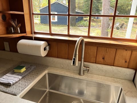 Overlooking the private backyard and garage space holding bike and toys for you!