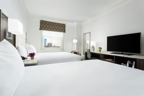 Kick back and stream favorites from bed with big-screen TV.