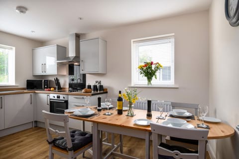 Extended dining table comfortably seating 4