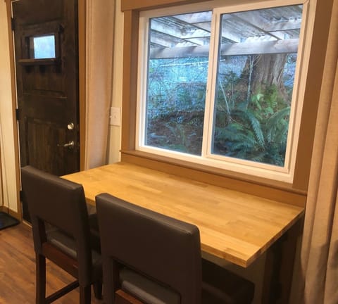 Dining table with outdoor view, folds down for convenience