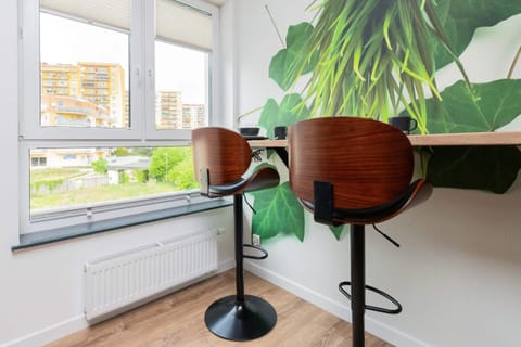 Dining area with high top and bar chairs.