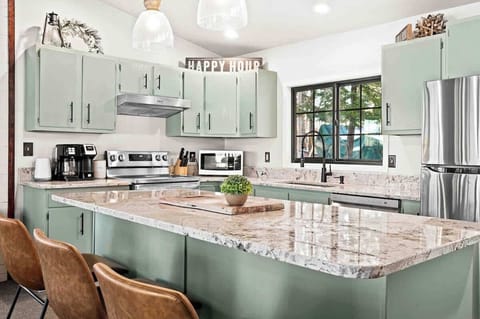 Updated and fully stocked kitchen. Granite counter tops, SS appliances, seperate beverage fridge, dishwasher.