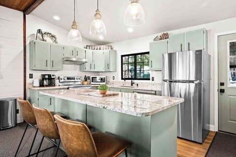 Open kitchen that is fully stocked with all the amenities 