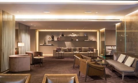 Unwind with cocktails in a plush, softly lit lounge.