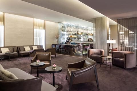 Unwind in a stylish lounge with plush seating and soft lighting.